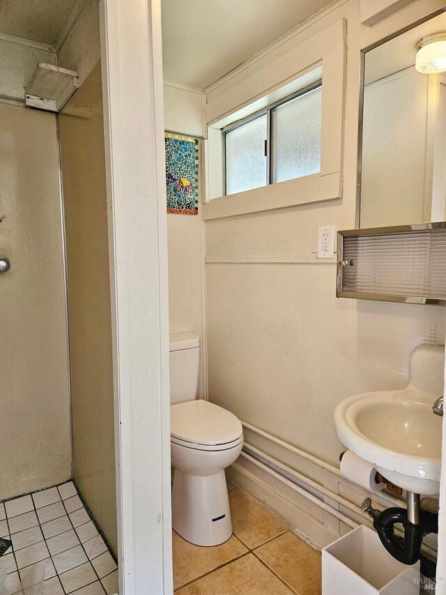 195 Ocean View Ave, Bodega Bay, CA 94923 - bathroom with tile patterned flooring, toilet, walk in shower, and a sink