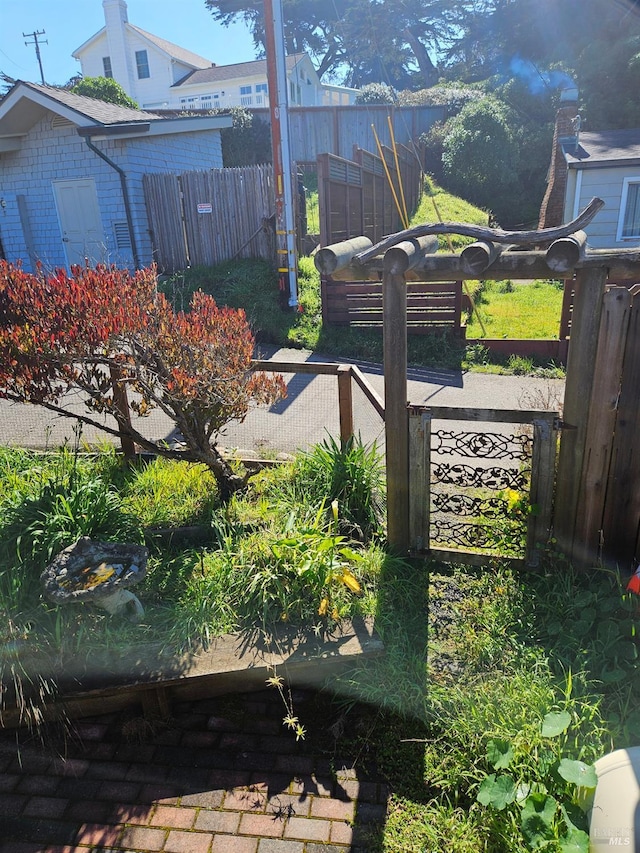 view of gate featuring fence