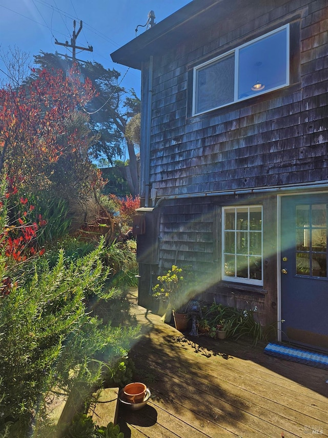 view of home's exterior featuring a wooden deck