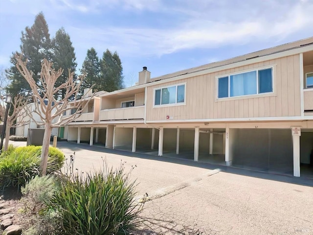 view of property with community garages