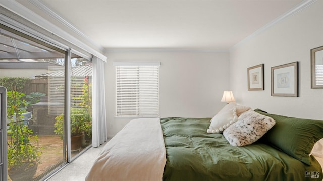 bedroom featuring ornamental molding and carpet flooring