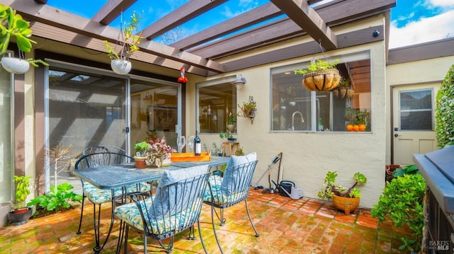 view of patio with outdoor dining area and a pergola