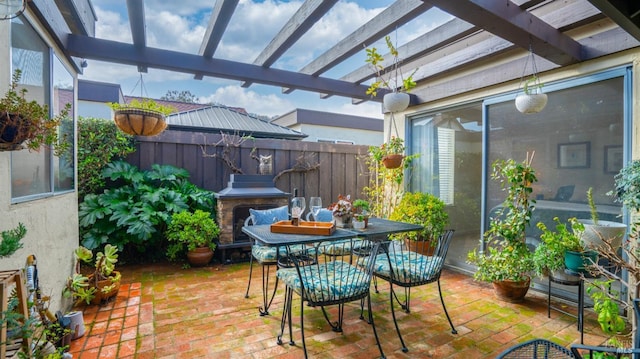 view of patio with outdoor dining area, a grill, fence, and a pergola