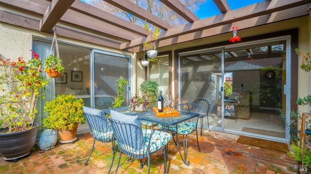 view of patio with outdoor dining area and a pergola