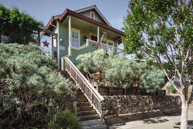 view of front of home featuring stairway