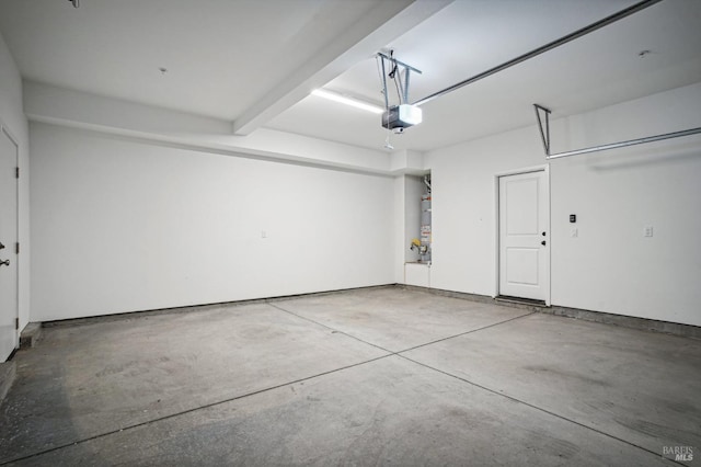 garage featuring a garage door opener and water heater