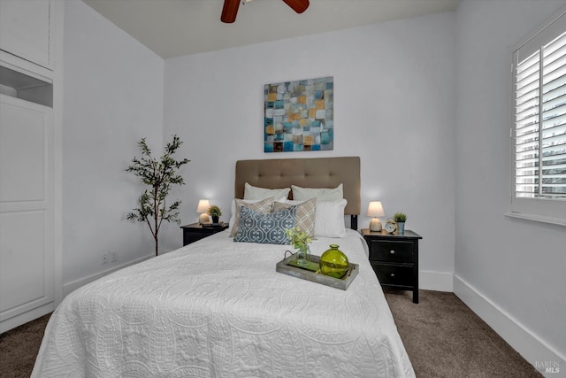 carpeted bedroom featuring ceiling fan and baseboards