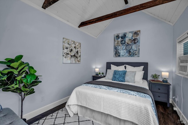 bedroom with lofted ceiling with beams, baseboards, and wood finished floors