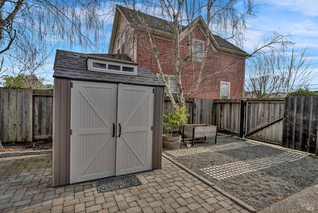 view of shed featuring a fenced backyard