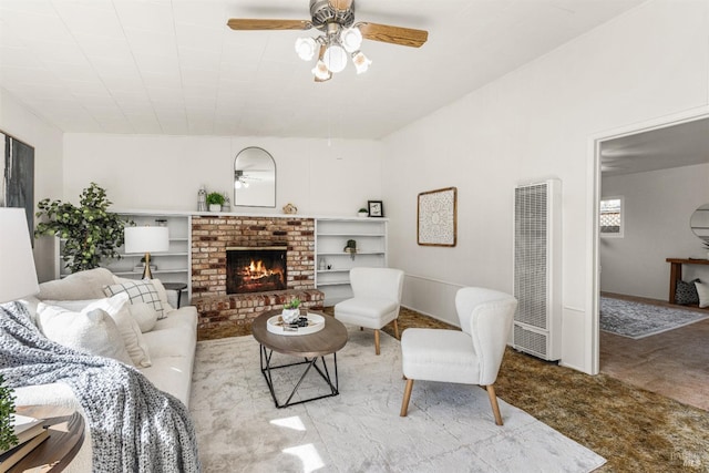 living area with carpet, a fireplace, a ceiling fan, and a heating unit