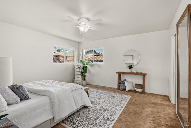 bedroom with ceiling fan and carpet flooring