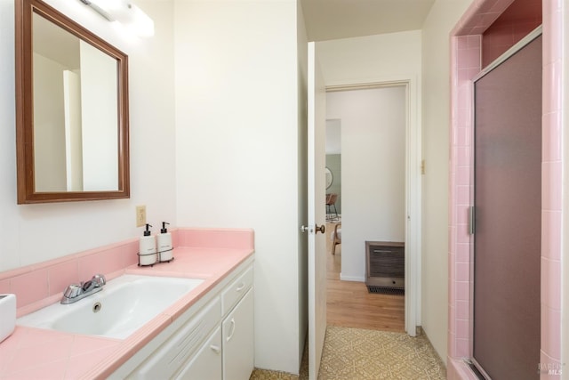 full bathroom featuring a shower stall, visible vents, and vanity