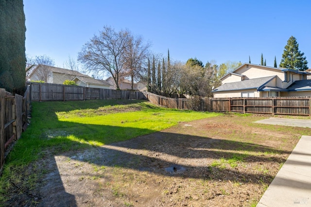 view of yard featuring a fenced backyard