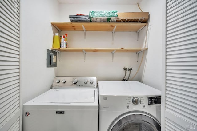 clothes washing area featuring laundry area and washing machine and clothes dryer