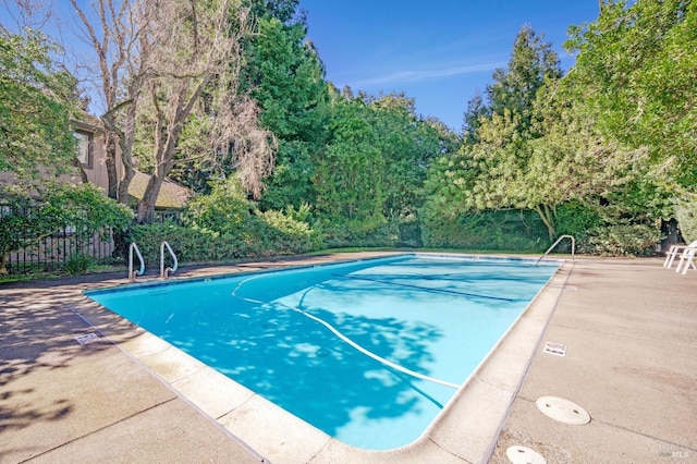 view of pool with fence