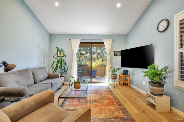 living area featuring recessed lighting, vaulted ceiling, baseboards, and wood finished floors