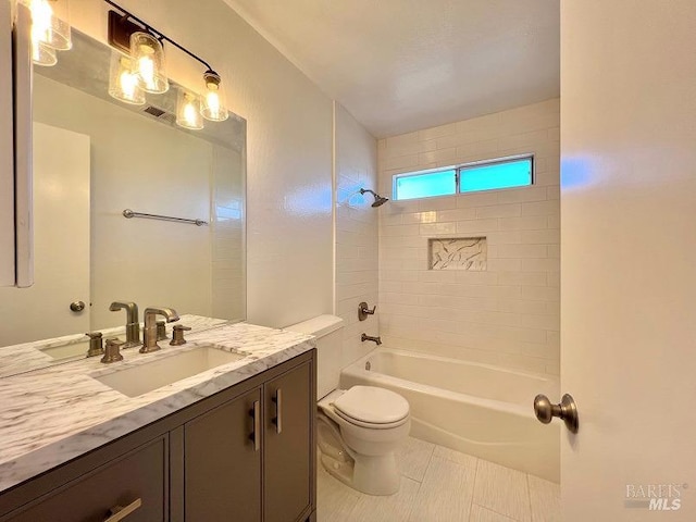 bathroom with visible vents, toilet, tile patterned flooring, bathtub / shower combination, and vanity