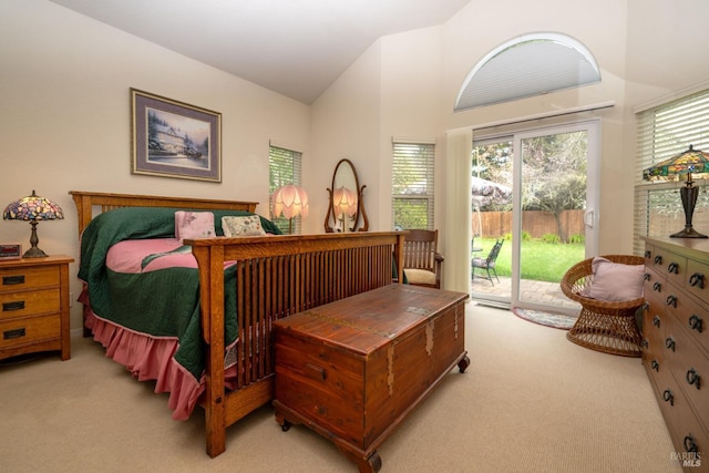 bedroom featuring light carpet, access to outside, and high vaulted ceiling