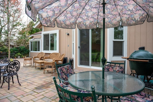 view of patio featuring outdoor dining area