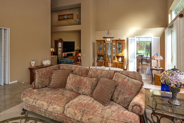 living area with a wealth of natural light and a high ceiling