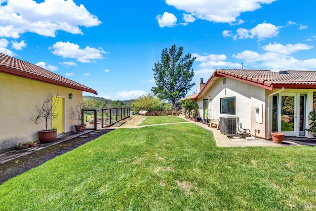 view of yard with a patio area and central AC unit
