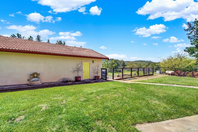 view of yard featuring a gate and fence