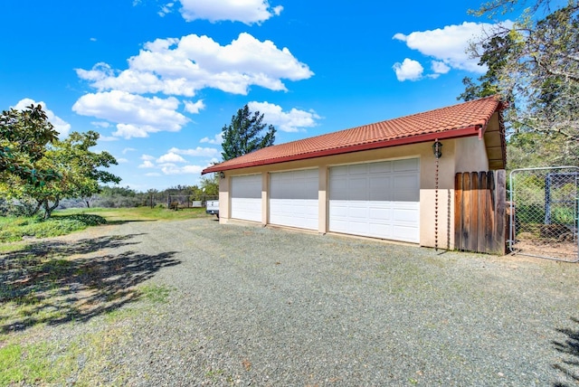 detached garage with fence