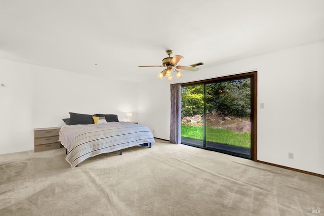 bedroom featuring baseboards, visible vents, and light colored carpet