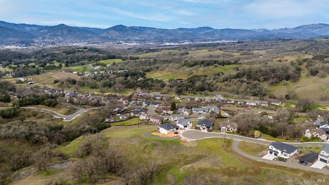 drone / aerial view featuring a residential view and a mountain view