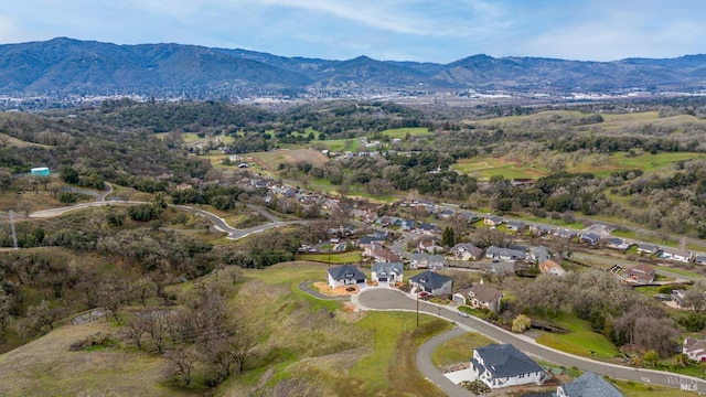 drone / aerial view with a residential view and a mountain view