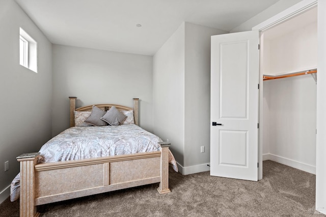 bedroom featuring carpet floors and baseboards