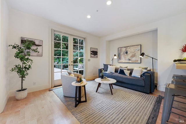 living room with french doors, recessed lighting, wood finished floors, and baseboards