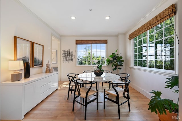 dining space featuring baseboards, ornamental molding, recessed lighting, and light wood-style floors