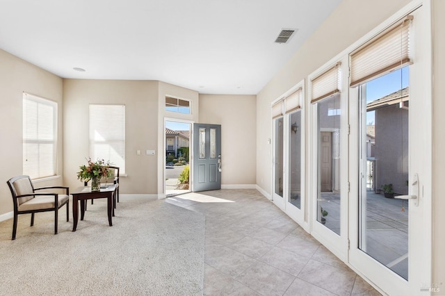 interior space with french doors and visible vents