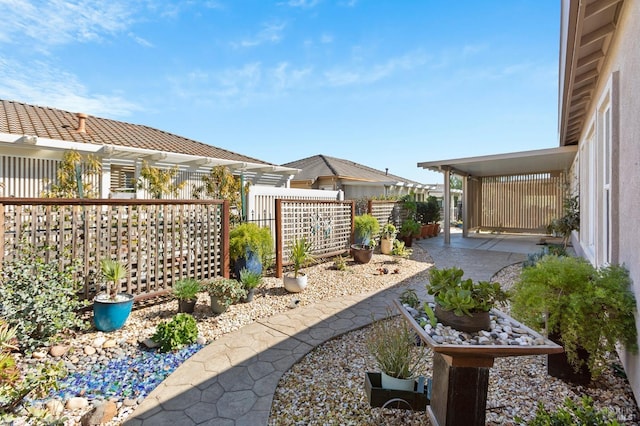 view of yard featuring a patio and fence