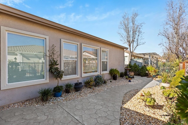 view of property exterior with stucco siding