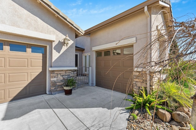 garage with concrete driveway