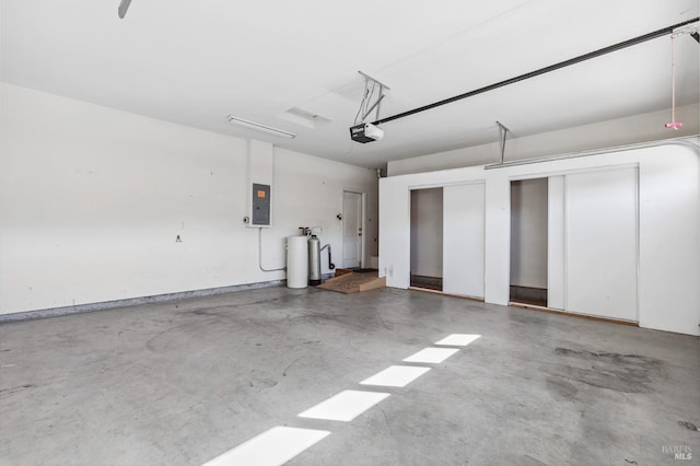garage featuring electric panel and a garage door opener