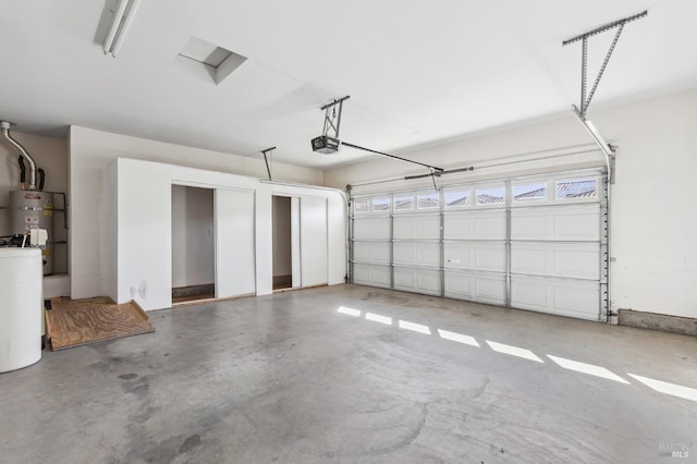 garage with secured water heater and a garage door opener