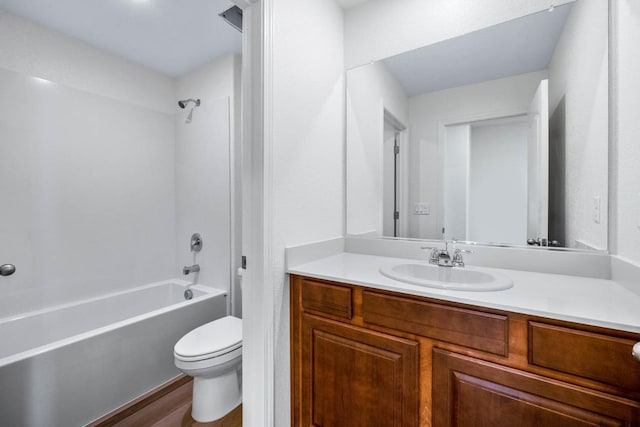 bathroom with  shower combination, vanity, toilet, and wood finished floors