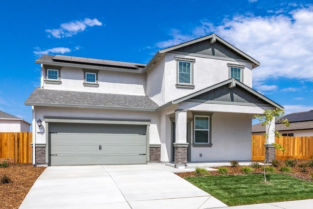 view of front of property featuring driveway, stucco siding, fence, and an attached garage