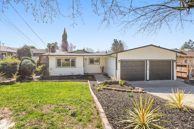 ranch-style house with a garage, fence, driveway, a front lawn, and a chimney