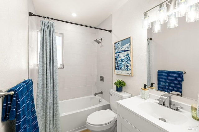 bathroom with vanity, toilet, and shower / bath combo with shower curtain