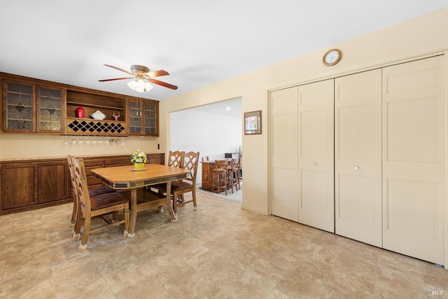 dining space with ceiling fan