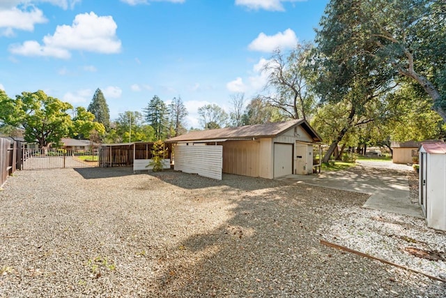 exterior space with fence and an outbuilding