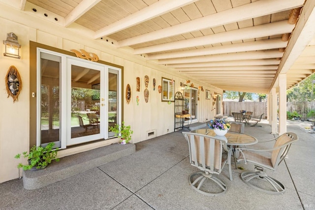 view of patio / terrace featuring fence and outdoor dining area