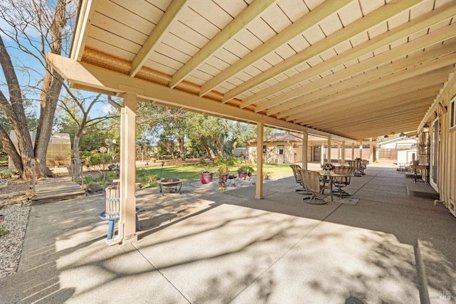 view of patio / terrace featuring an outdoor fire pit and outdoor dining area