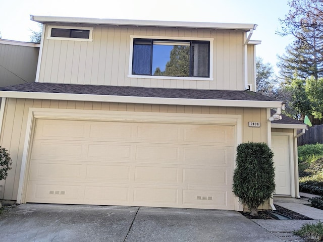 garage featuring driveway