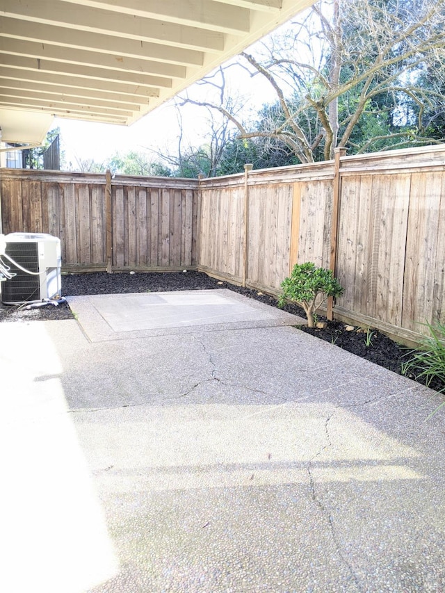 view of patio featuring central AC and a fenced backyard