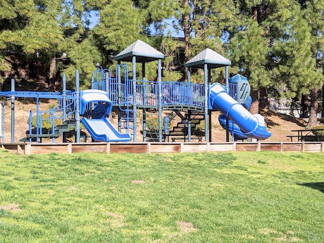 community playground featuring a lawn